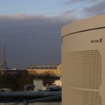 ericsson network eqipment on a rooftop in paris with the eiffel tower in the background