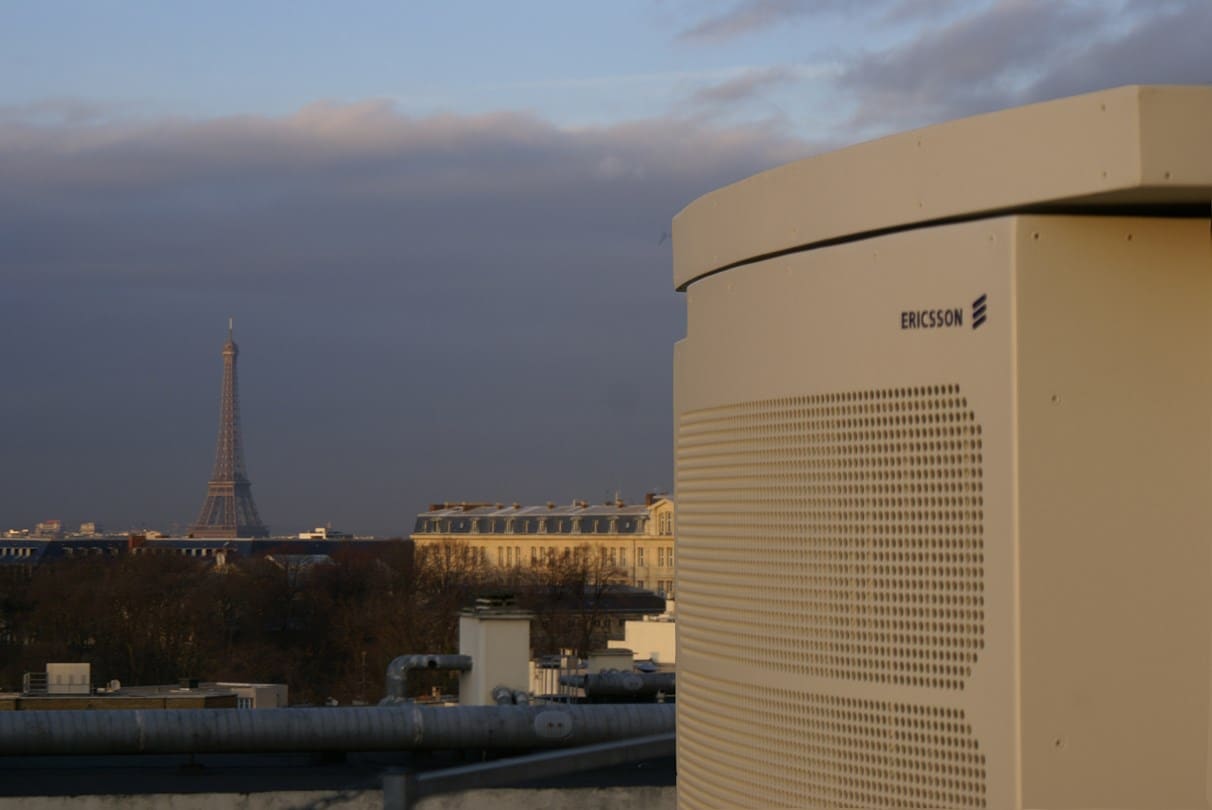 ericsson network eqipment on a rooftop in paris with the eiffel tower in the background